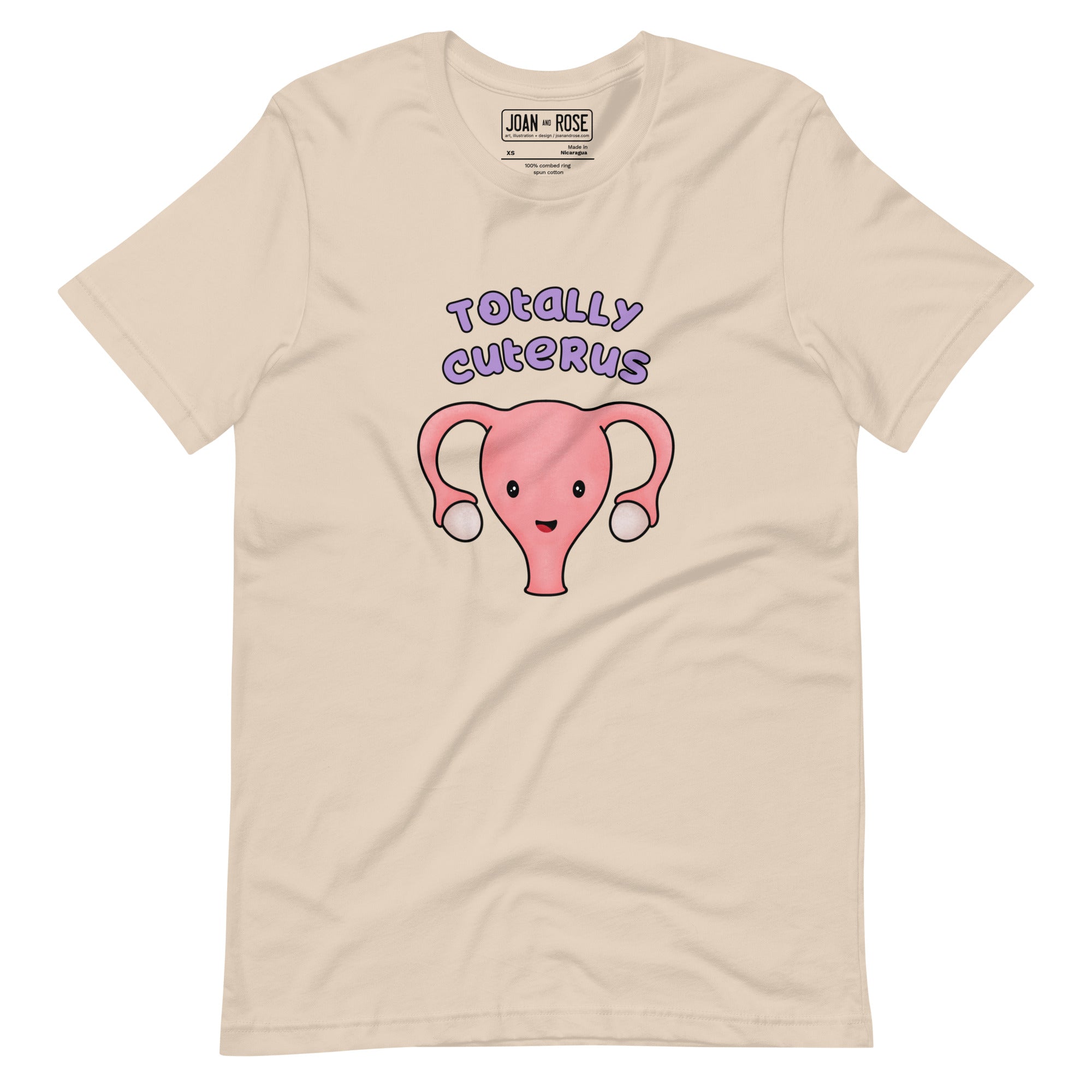 Cream coloured t-shirt with an illustration of a cute uterus character smiling with the text in purple 'Totally Cuterus'